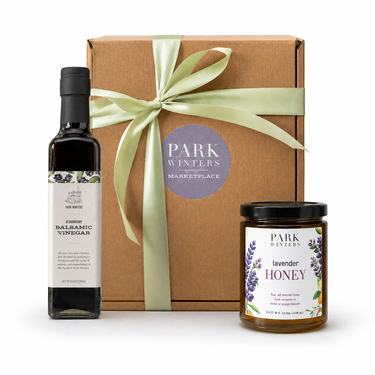 Gift set with balsamic vinegar, lavender honey, and a brown box labeled 'Park Winters' on a white background.