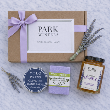 Gift set from Park Winters with lavender-themed products on a textured surface