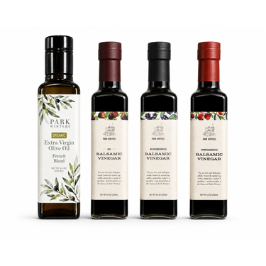 Four bottles of Park Wines olive oil and vinegar on a white background