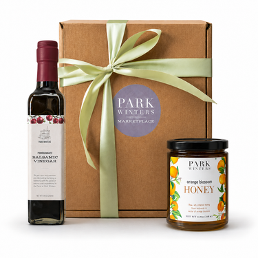 Gift set with Orange blossom honey, pomegranate balsamic and a gift box with a ribbon.