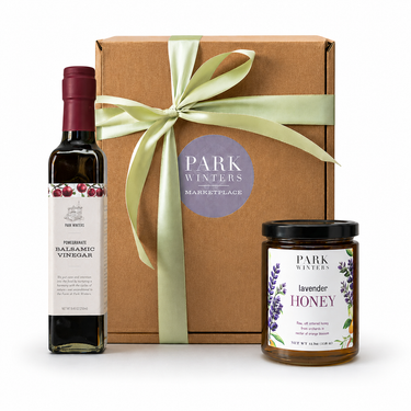 Gift set with balsamic vinegar, lavender honey, and a box labeled 'Park Winters' on a white background.